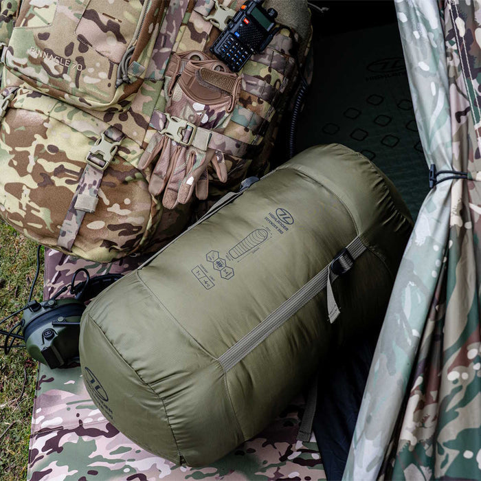 outdoor setup of the highlander defender 350 ranger green sleeping bag