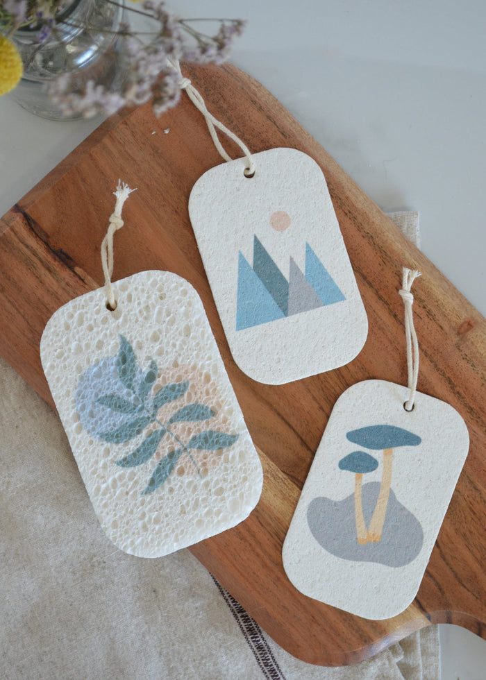Three cellulose sponges tags with forest nature-themed designs