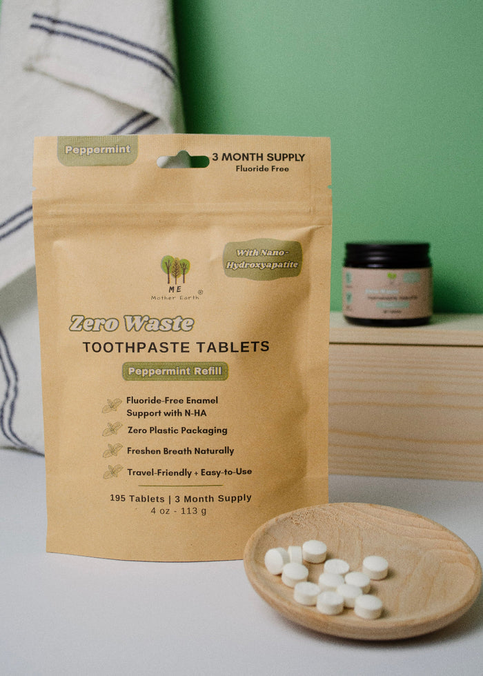 Package of Zero Waste Toothpaste Tablets with a small bowl of tablets on a wooden surface.