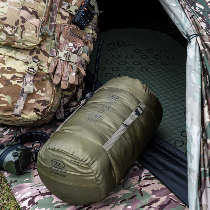 outdoor setup of the highlander defender 250 ranger green sleeping bag