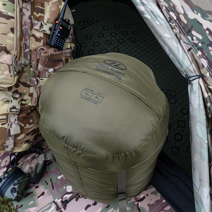 outdoor setup of the highlander defender 450 ranger green sleeping bag