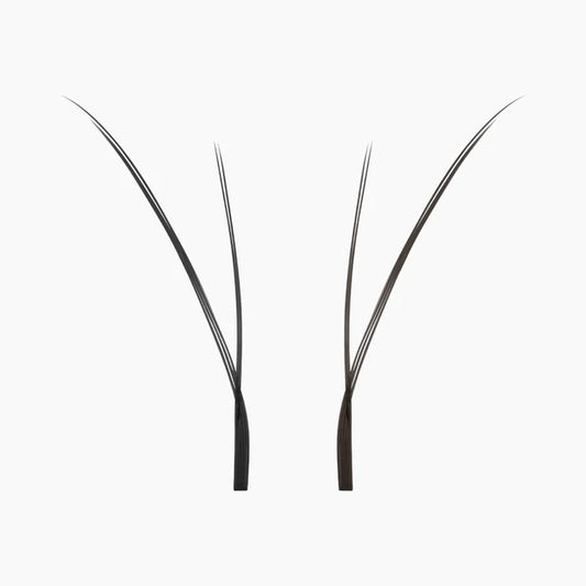 Close-up of two individual black Kitten Lash extension fans on a white background, highlighting their fine tips and lightweight fibres.