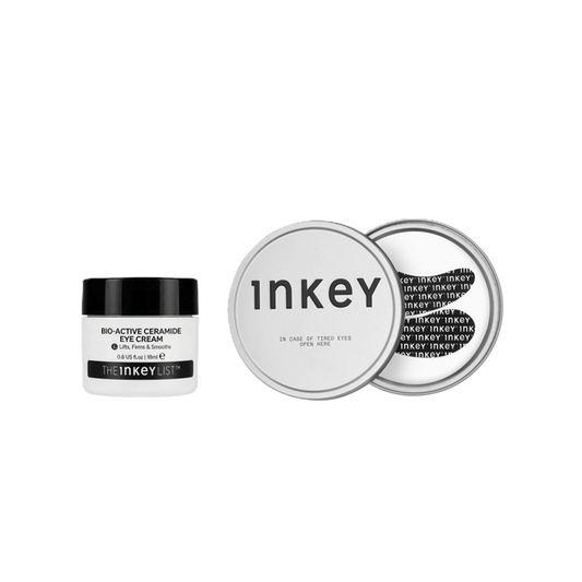 The Inkey Bio-Active Ceramide Eye Cream in a white jar with a black lid, shown next to two silver round tins displaying the product's packaging details on a solid white background.