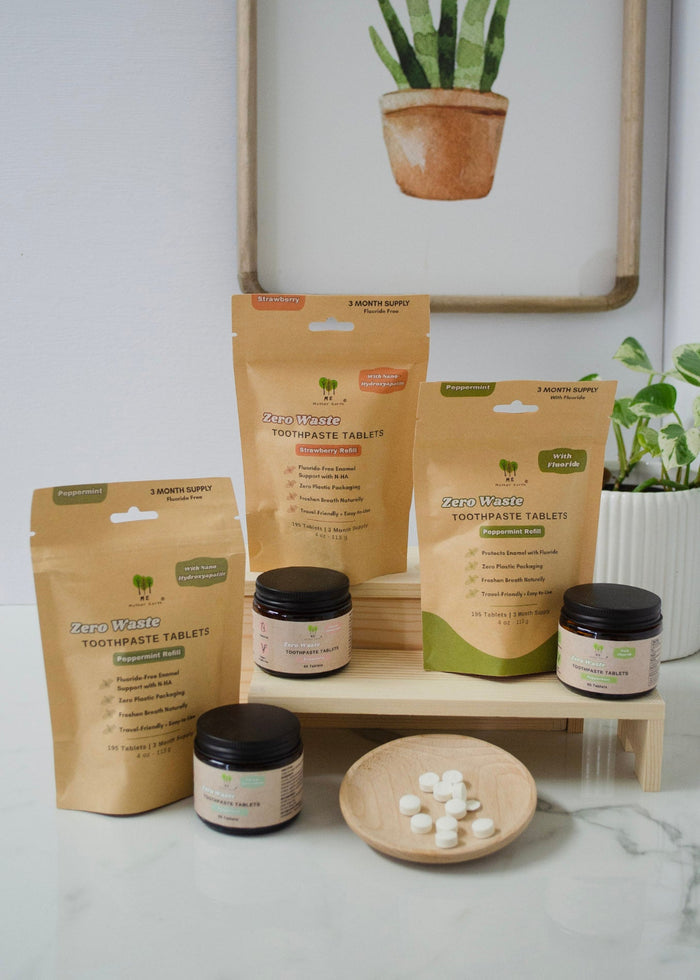 Toothpaste Tablet products on a wooden stand with a plant in the background